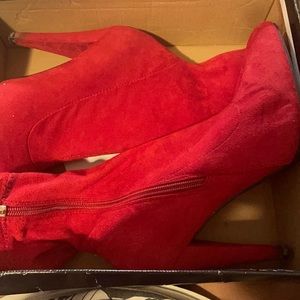 Red suede heeled ankle boots